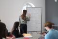 Students writing on board