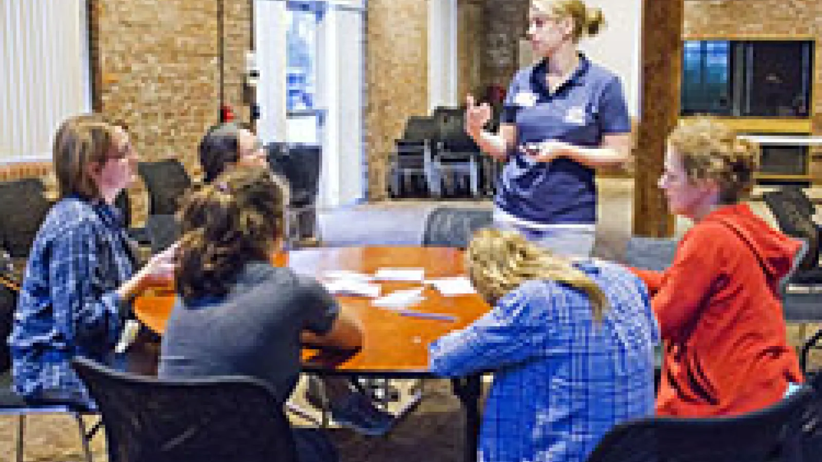 Young women and their moms at a workshop