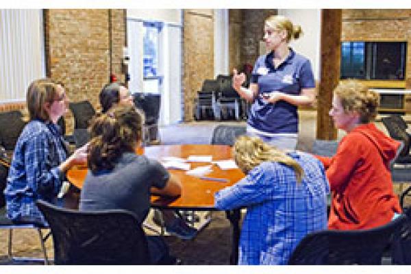 Young women and their moms at a workshop