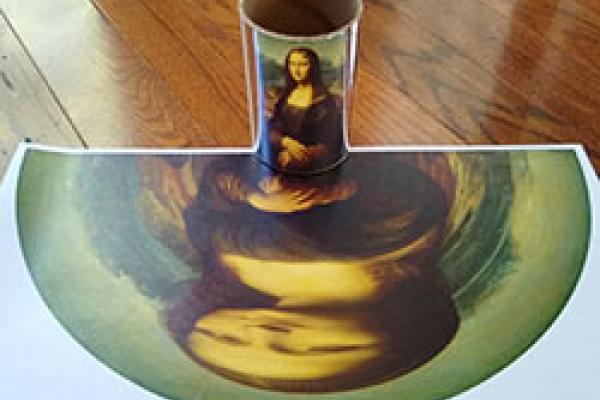 Distorted Mona Lisa reflects with right proportions on a cylindric mirror.
