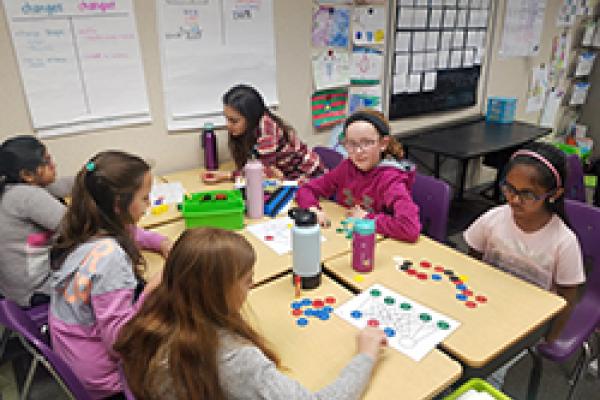 Students playing games on graphs.