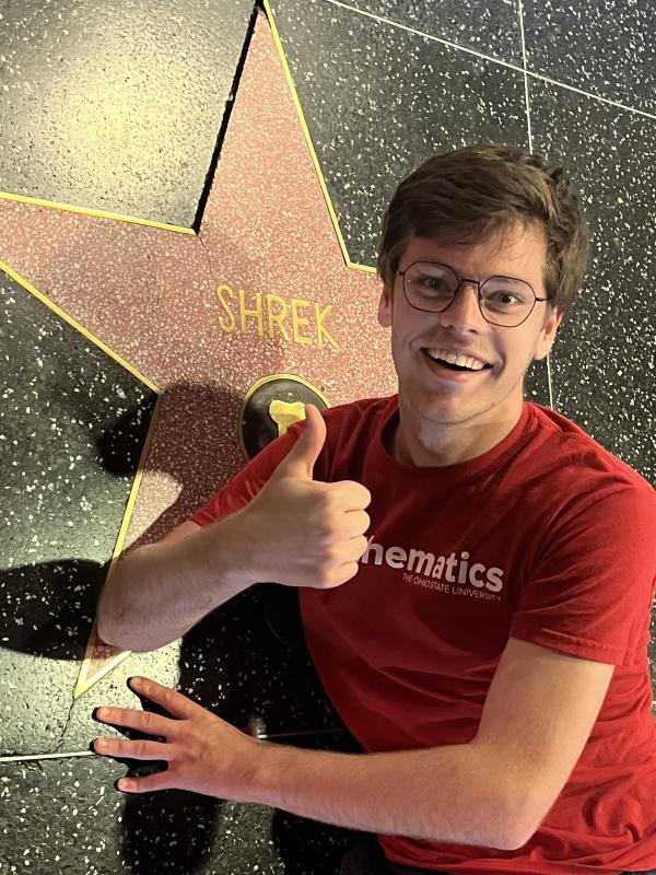 A picture of Dennis posing next to the star for Shrek on the Hollywood Walk of Fame