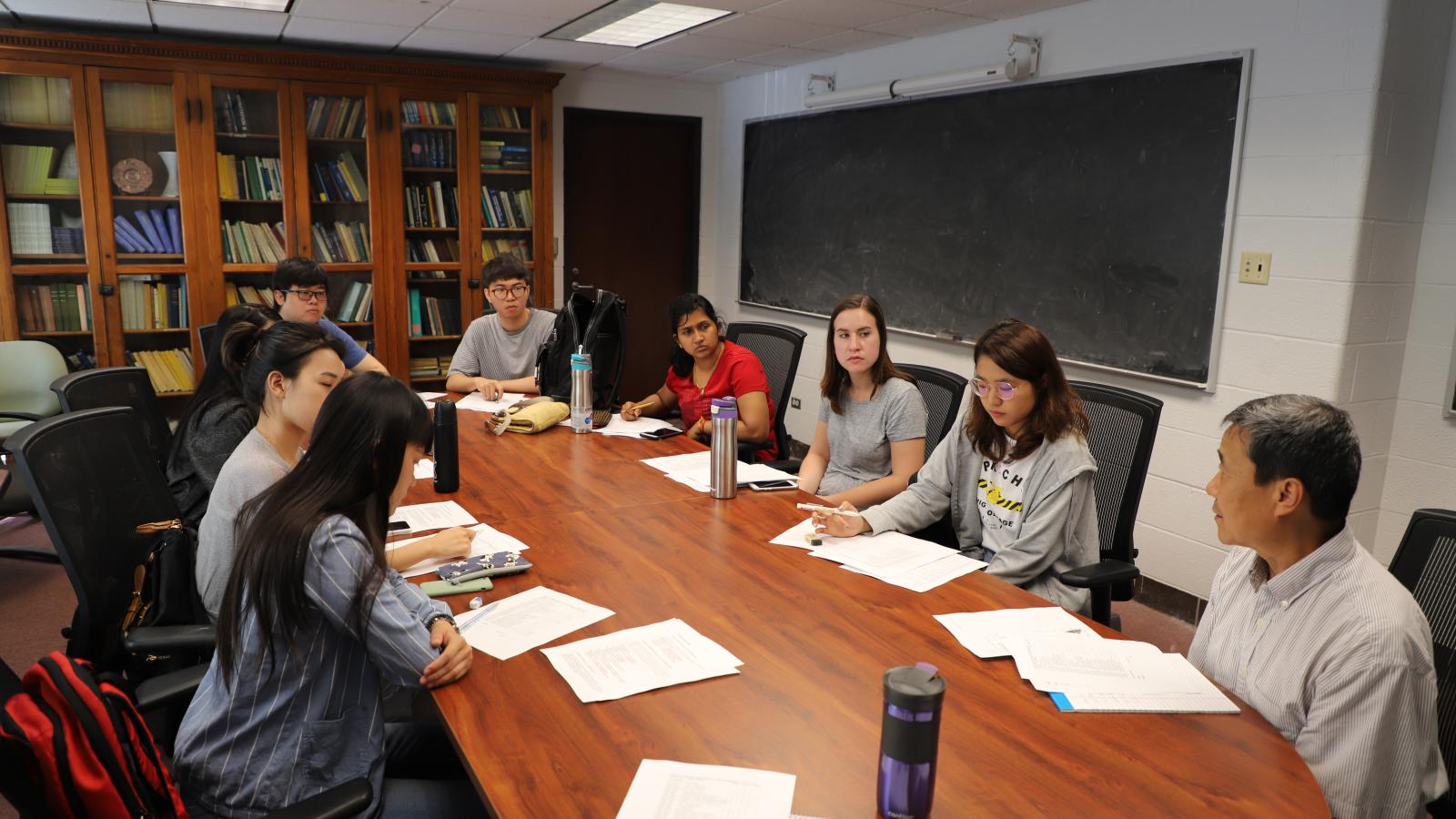 Students attending a professor's office hours. 