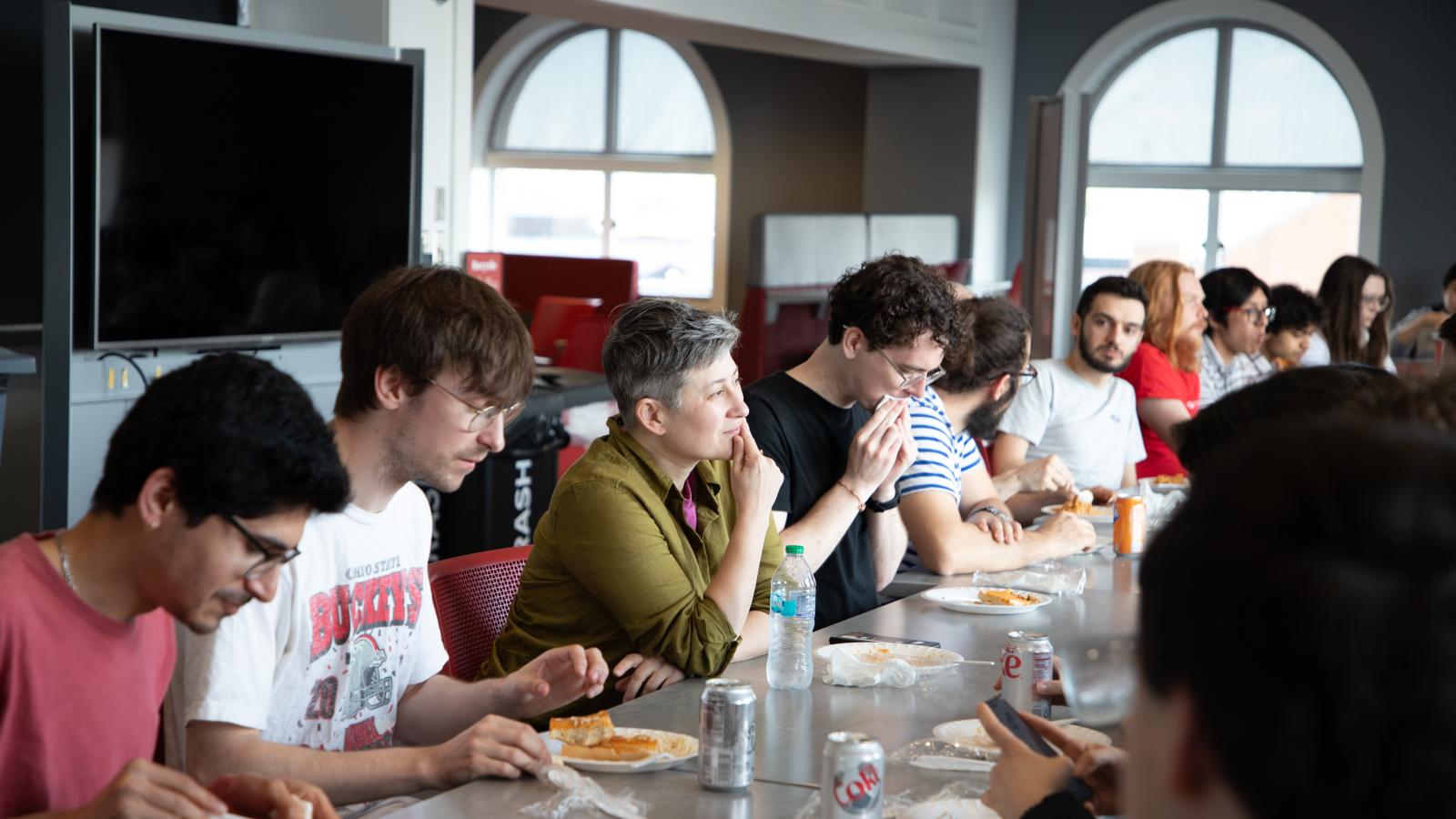Dr. Duchin eating lunch with graduate students before the talk