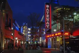 Columbus Gateway district at night with neon signs and lit up buildings