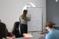 Students writing on board