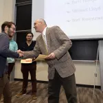 student receiving certificate