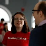 students and faculty talking
