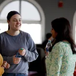 staff and students talking