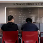 Students looking at white board