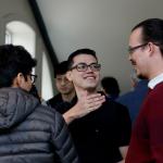 faculty and students talking