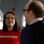 students and faculty talking