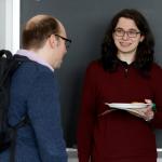 student and faculty talking