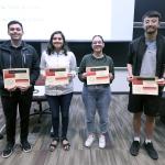 Students holding certificates