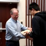 Student receiving award