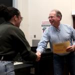 Student receiving award